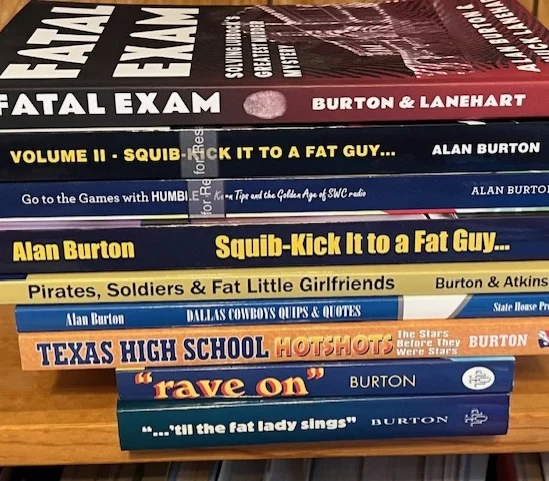 Stack of books written by Alan Burton with Fatal Exam on top, down to 'Til the Fat Lady Sings at the bottom